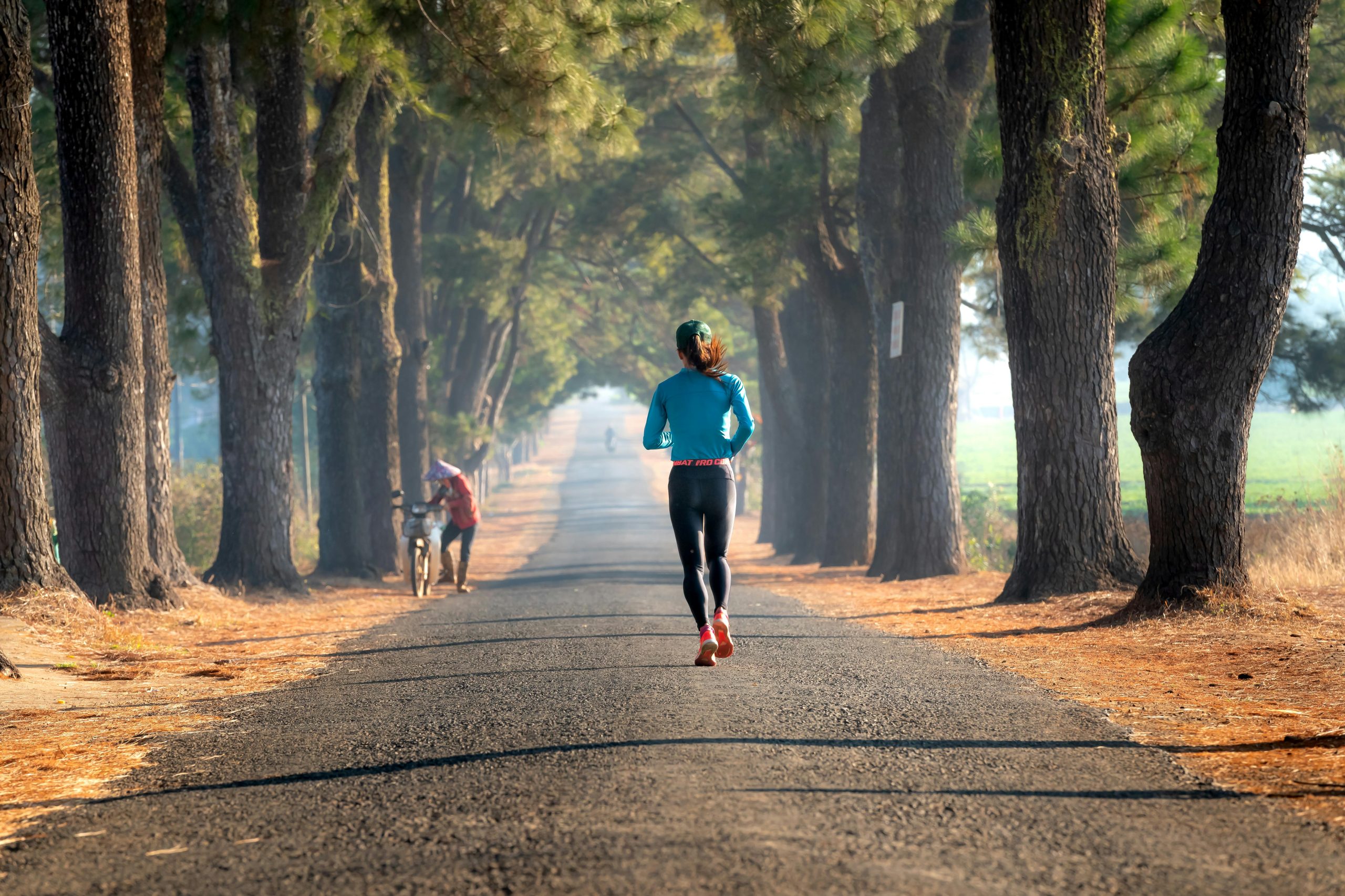 athlete running road athlete running road