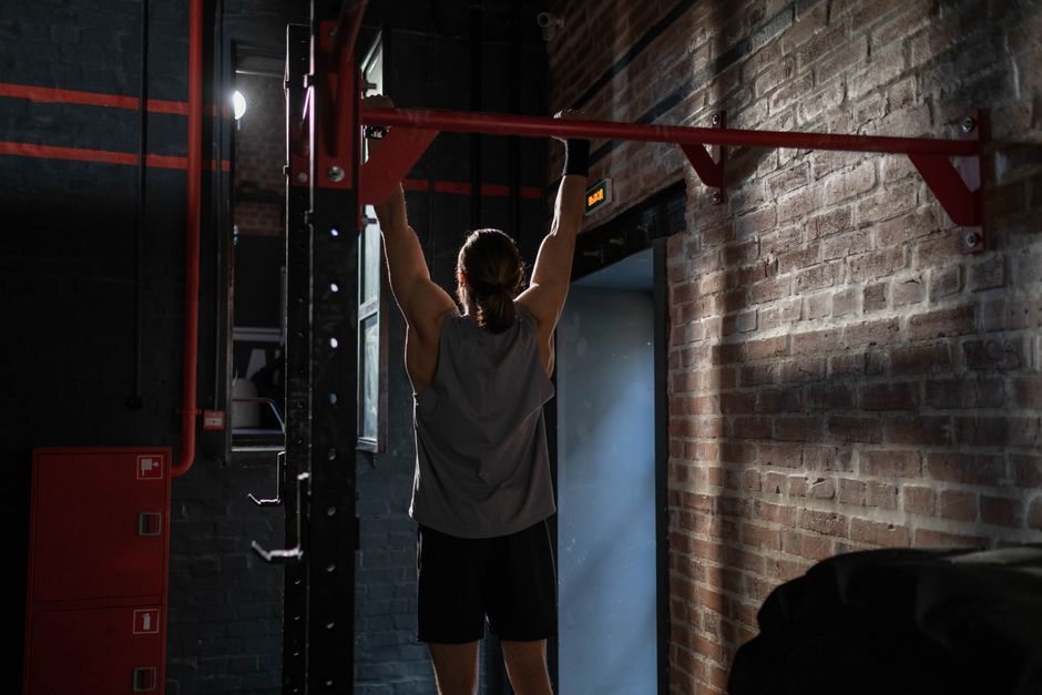man doing pull up man doing pull up