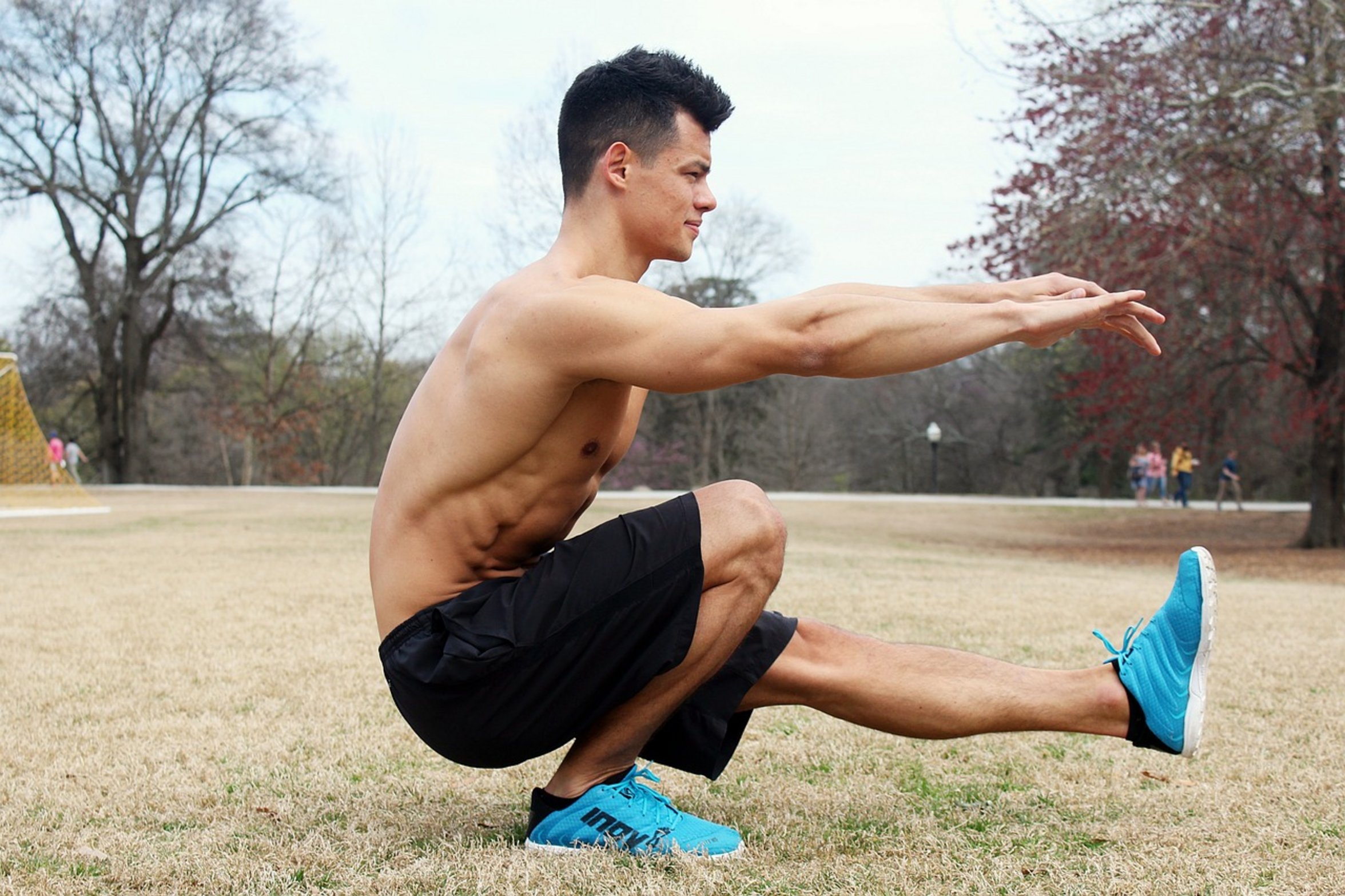 athlete performing back squat athlete performing back squat