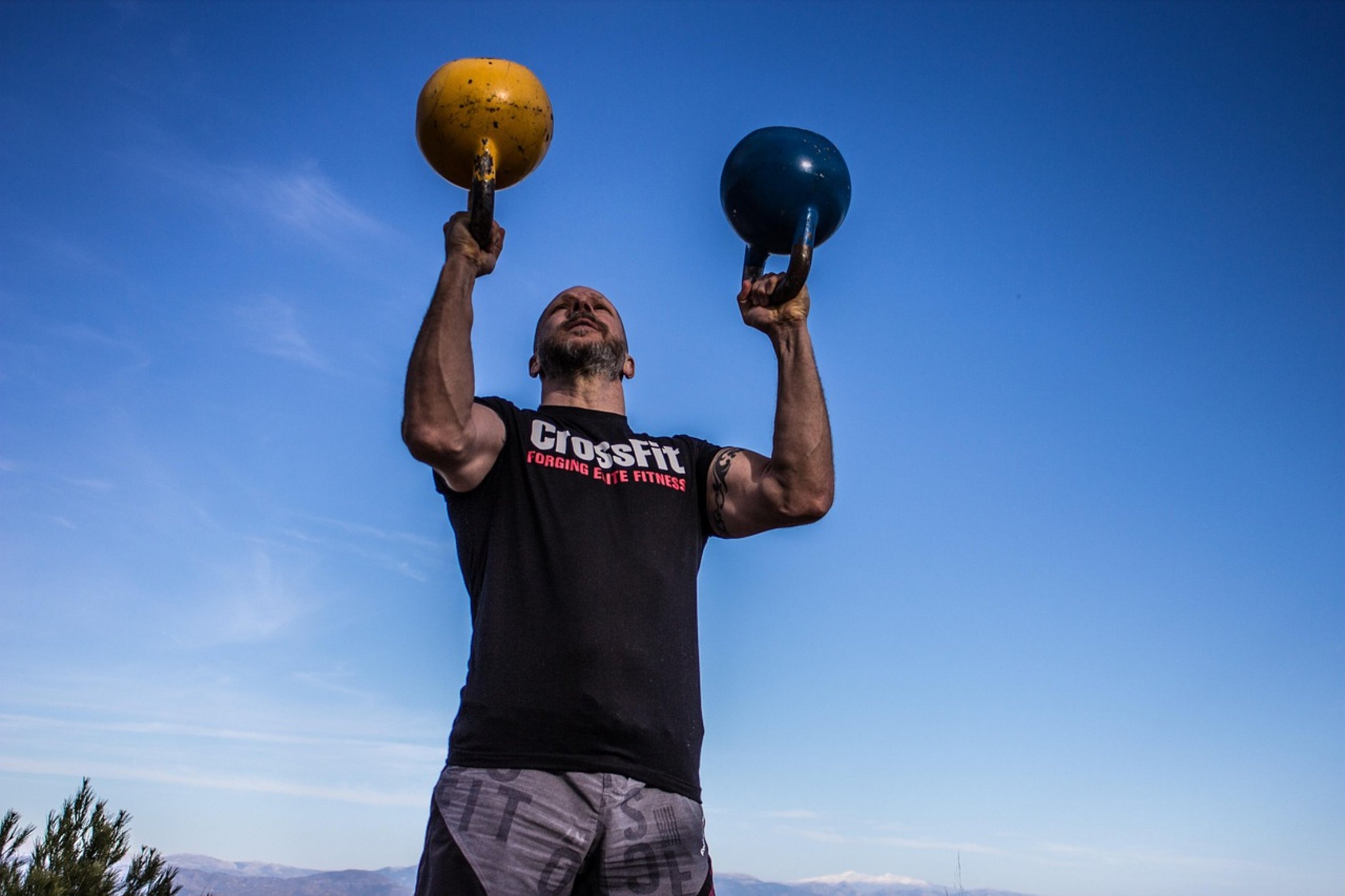 man overhead kettlebell press man overhead kettlebell press