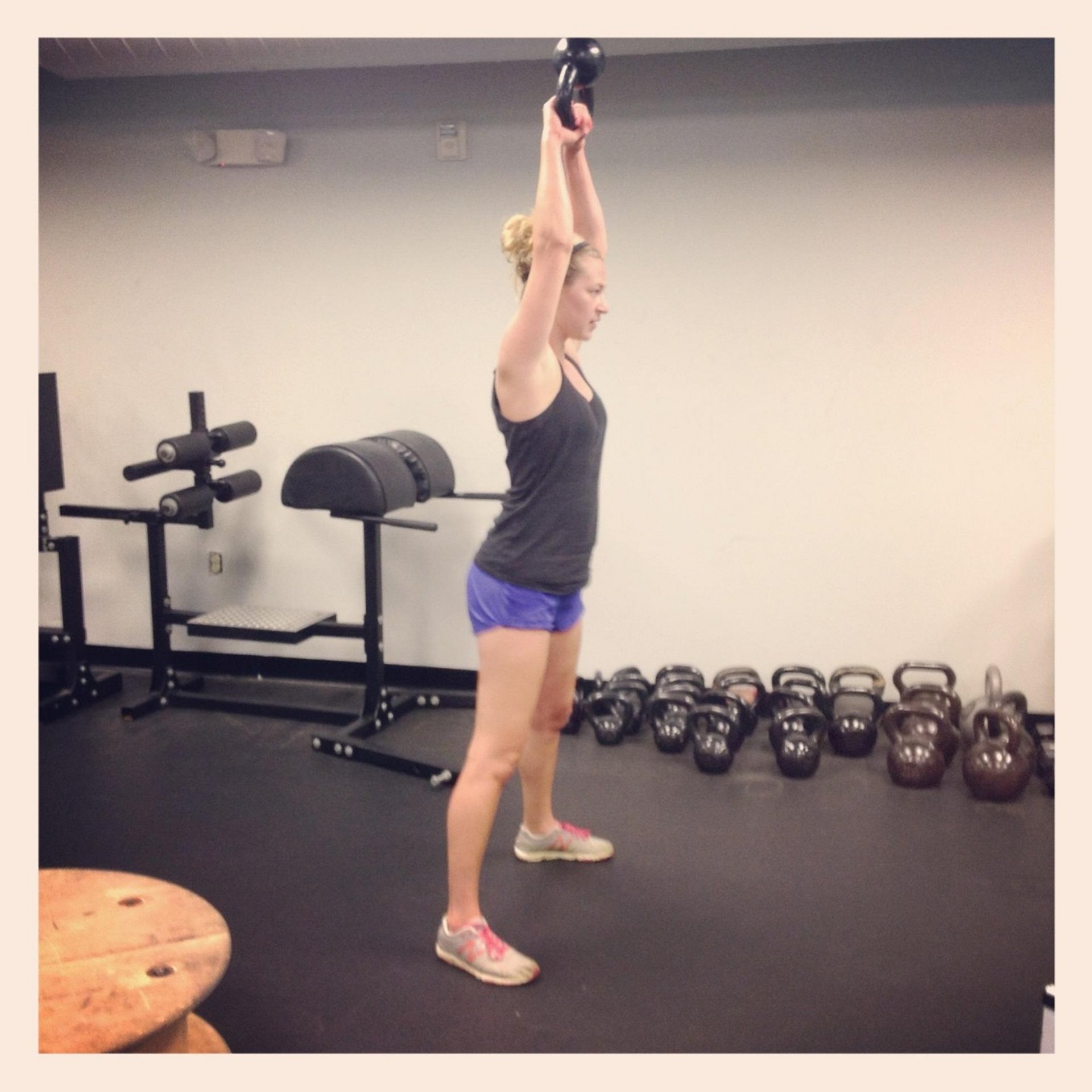 person lifting kettlebell person lifting kettlebell